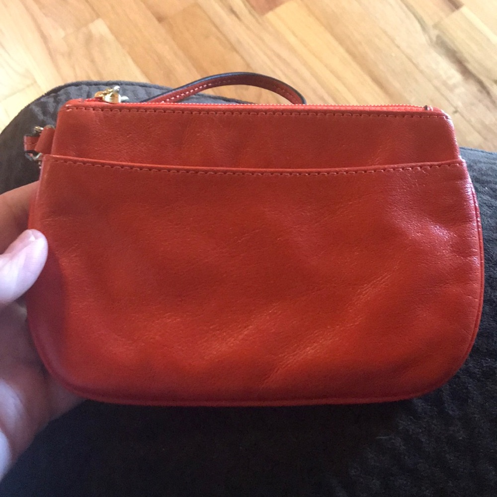 Orange leather Coach wristlet